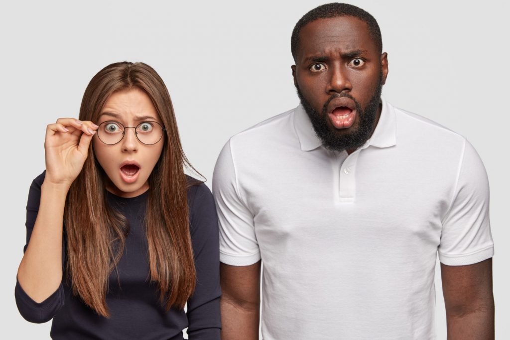 photo mixed race colleagues stare dark skinned guy emotive caucasian woman cant believe their eyes