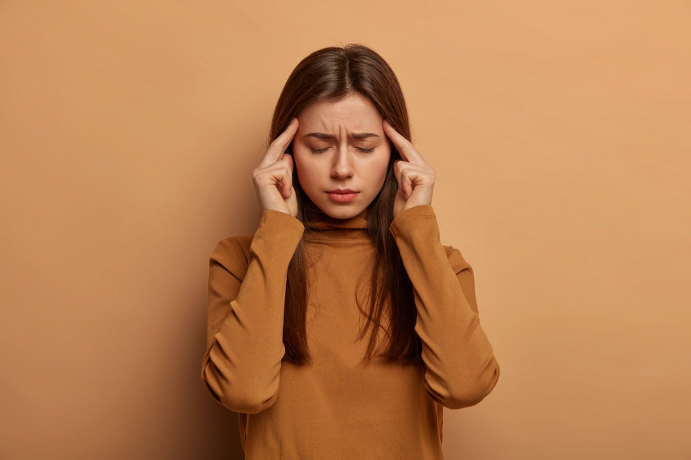 depressed frustrated european woman tries focus keeps index fingers temples ponders important decision closes eyes wears brown turtleneck scaled depressed frustrated european woman tries focus keeps index fingers temples ponders important decision closes eyes wears brown turtleneck