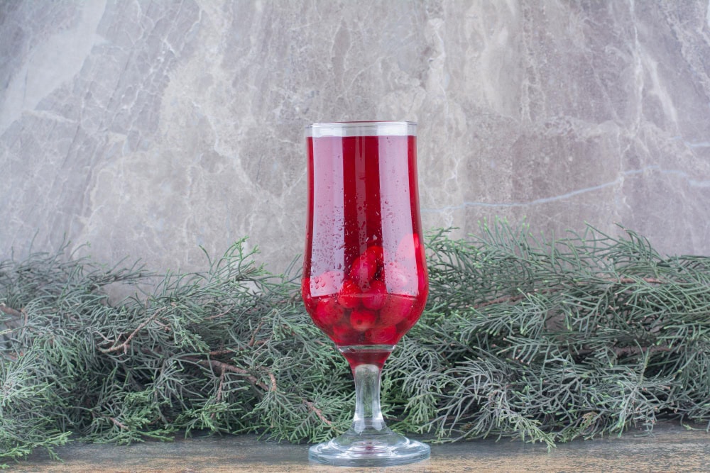 glass rosehips juice marble background high quality photo (1)