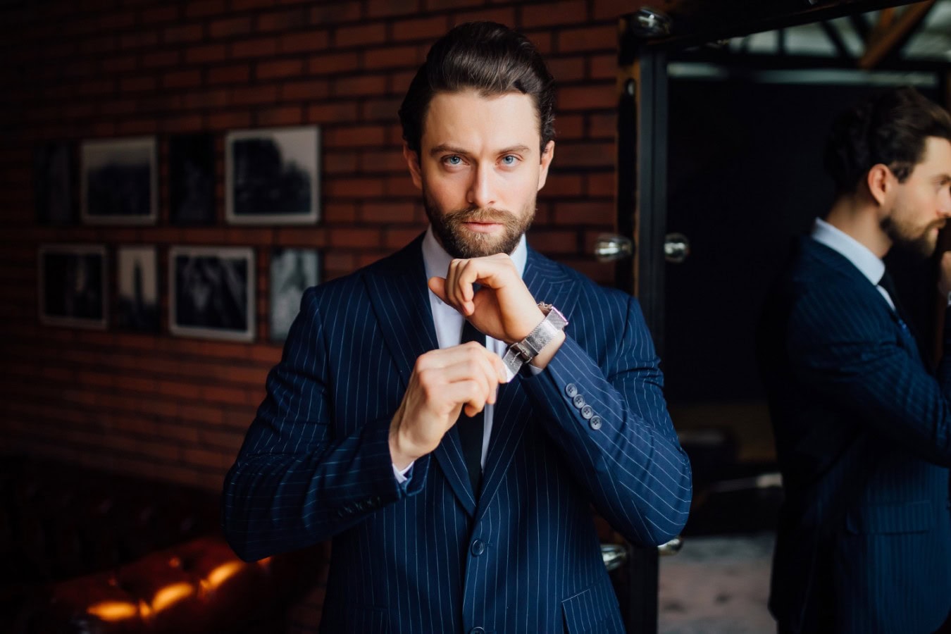 handsome business man looking camera with watch his hand scaled handsome business man looking camera with watch his hand