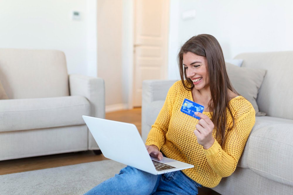 picture showing pretty woman shopping online with credit card woman holding credit card using laptop online shopping concept picture showing pretty woman shopping online with credit card woman holding credit card using laptop online shopping concept